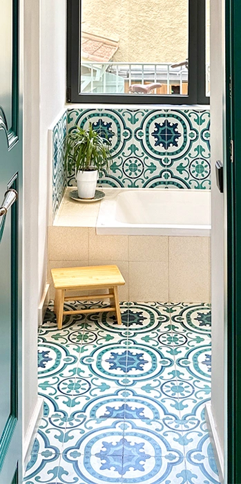 Green and white bathroom cement tile floor